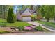 Beautiful two-story home with a well-kept lawn and colorful flowerbeds at 1725 Silverchase Sw Dr, Marietta, GA 30008