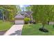 Charming two-story brick home with a well-manicured lawn and two-car garage at 1725 Silverchase Sw Dr, Marietta, GA 30008