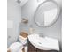 Powder room with modern sink, vanity, commode, and light gray paint at 1725 Silverchase Sw Dr, Marietta, GA 30008
