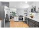 Spacious kitchen with stainless steel appliances, subway tile backsplash, and gray cabinets at 1725 Silverchase Sw Dr, Marietta, GA 30008