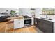 Contemporary kitchen with stainless steel appliances, wood countertop, and floating shelves at 1725 Silverchase Sw Dr, Marietta, GA 30008