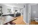 Modern kitchen boasts stainless appliances, butcher block island, white subway tile, and wood floors at 1725 Silverchase Sw Dr, Marietta, GA 30008