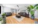 Bright living room with hardwood floors, neutral paint, ceiling fan, and stylish decor at 1725 Silverchase Sw Dr, Marietta, GA 30008