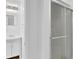 Bathroom features white vanity and a shower with glass doors at 272 Colchester Dr, Stone Mountain, GA 30088