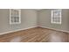 Bedroom with natural lighting and beautiful wood-look flooring at 272 Colchester Dr, Stone Mountain, GA 30088