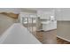 Kitchen featuring bright countertops, white cabinets, and modern wood flooring at 272 Colchester Dr, Stone Mountain, GA 30088
