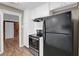 Kitchen shows black appliances, including range and refrigerator at 272 Colchester Dr, Stone Mountain, GA 30088