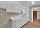 Traditional-style kitchen features white cabinets and light countertops at 272 Colchester Dr, Stone Mountain, GA 30088