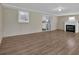 Living room with a fireplace, hardwood floors, and natural light at 272 Colchester Dr, Stone Mountain, GA 30088