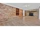 Living room with a brick wall and a decorative fireplace at 272 Colchester Dr, Stone Mountain, GA 30088