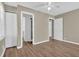 The main bedroom has a ceiling fan and wood look flooring at 272 Colchester Dr, Stone Mountain, GA 30088