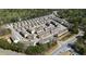 Extensive aerial view of a neighborhood showcasing the layout of multiple townhomes at 3567 Hidden Valley Cir, Lawrenceville, GA 30044
