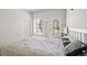 Bright bedroom with white walls, a window, and a comfortable queen-sized bed at 3567 Hidden Valley Cir, Lawrenceville, GA 30044