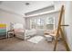 Charming bedroom with a large window for plenty of natural light, creating a bright and airy space at 3567 Hidden Valley Cir, Lawrenceville, GA 30044