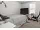 Comfortable bedroom with a large window and neutral walls, creating a serene and peaceful atmosphere at 3567 Hidden Valley Cir, Lawrenceville, GA 30044