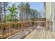 Inviting deck with wooden railing and view of lush greenery, perfect for outdoor relaxation at 3567 Hidden Valley Cir, Lawrenceville, GA 30044