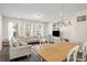 Bright open concept living and dining area with hardwood floors and lots of natural light at 3567 Hidden Valley Cir, Lawrenceville, GA 30044