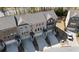 Aerial view of brick townhomes with driveways and attached garages at 3567 Hidden Valley Cir, Lawrenceville, GA 30044