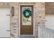 Close-up of the front door of the townhome with brick facade and address number at 3567 Hidden Valley Cir, Lawrenceville, GA 30044
