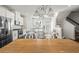 Modern kitchen with stainless steel appliances, granite countertops, tile backsplash and adjacent staircase at 3567 Hidden Valley Cir, Lawrenceville, GA 30044