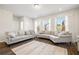Bright living room featuring hardwood floors, seating area, and plenty of natural light at 3567 Hidden Valley Cir, Lawrenceville, GA 30044