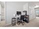 Bright office area features a white desk, ergonomic chair, and ample storage space at 3567 Hidden Valley Cir, Lawrenceville, GA 30044