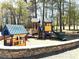 playground with slides, playhouse, climbing apparatus, and a rock wall at 3567 Hidden Valley Cir, Lawrenceville, GA 30044