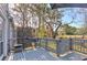 Back deck offers outdoor dining and relaxation with greenery views and a decorative screen at 403 Oak Harbor Ct, Marietta, GA 30066