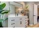 Bathroom featuring a vanity with white countertop, black hardware, and decorative plants at 403 Oak Harbor Ct, Marietta, GA 30066