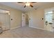 Open bedroom with a view of the bathroom, featuring carpeted floors and a ceiling fan at 403 Oak Harbor Ct, Marietta, GA 30066