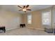 Neutral bedroom featuring a ceiling fan, carpet flooring, and two windows offering natural light at 403 Oak Harbor Ct, Marietta, GA 30066