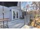 Cozy outdoor deck with a dining area and elegant French doors at 403 Oak Harbor Ct, Marietta, GA 30066