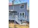 Two-story house with a deck, staircase, and outdoor dining area at 403 Oak Harbor Ct, Marietta, GA 30066