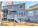 Backyard of a two-story house with deck, stairs, and screened porch at 403 Oak Harbor Ct, Marietta, GA 30066
