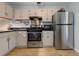 Well-equipped kitchen with stainless steel appliances and white cabinets at 403 Oak Harbor Ct, Marietta, GA 30066