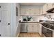 Well-equipped kitchen with stainless steel appliances and white cabinets at 403 Oak Harbor Ct, Marietta, GA 30066