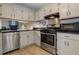 Well-equipped kitchen with stainless steel appliances, light countertops and flooring at 403 Oak Harbor Ct, Marietta, GA 30066