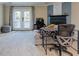 Comfortable living room with fireplace, desk, and French doors leading to the outdoors at 403 Oak Harbor Ct, Marietta, GA 30066