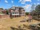 Spacious backyard featuring a patio, pergola, and lush landscaping at 4437 Blue Ridge Dr, Douglasville, GA 30135