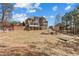 Large backyard with a patio, pergola, lush landscaping, and home at 4437 Blue Ridge Dr, Douglasville, GA 30135