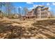 Spacious backyard with pergola, bocce court, and brick home exterior at 4437 Blue Ridge Dr, Douglasville, GA 30135