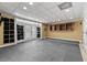Spacious basement area providing ample room for activities and storage, with double doors and shelving at 4437 Blue Ridge Dr, Douglasville, GA 30135