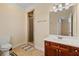 Bathroom featuring tile floor, shower with brick accent, and vanity at 4437 Blue Ridge Dr, Douglasville, GA 30135