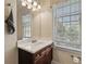 Traditional bathroom features vanity with a white countertop and natural lighting at 4437 Blue Ridge Dr, Douglasville, GA 30135