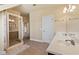 Bright bathroom featuring a glass shower, double sink vanity and neutral color palette at 4437 Blue Ridge Dr, Douglasville, GA 30135