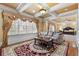 Luxurious primary bedroom suite featuring coffered ceilings, sitting area, and elegant decor at 4437 Blue Ridge Dr, Douglasville, GA 30135