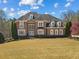 Elegant brick home with manicured front lawn and mature trees at 4437 Blue Ridge Dr, Douglasville, GA 30135