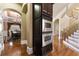 Built-in stainless steel microwave and oven tower with wooden cabinetry in the kitchen at 4437 Blue Ridge Dr, Douglasville, GA 30135