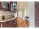 Elegant kitchen with custom cabinetry, granite countertops, and hardwood flooring at 4437 Blue Ridge Dr, Douglasville, GA 30135