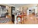 Open kitchen with a breakfast bar, stainless steel appliances, and hardwood floors at 4437 Blue Ridge Dr, Douglasville, GA 30135